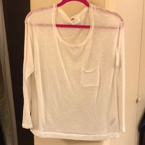 A long sleeve sweater or cover over camisole